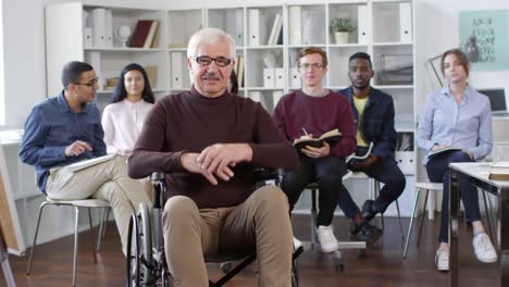 Portrait-of-Disabled-Teacher-and-Multiethnic-Students