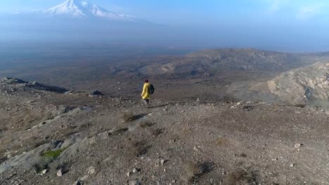 Aerial-View-One-Man-Walking-on-the-Fog-Mountain