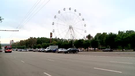 the-trolley-on-the-Avenue-in-Kirov-on-the-background-of-the-Ferris-wheel