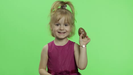 Girl-in-purple-dress-with-chocolate-egg.-Happy-four-years-old-child.-Chroma-Key