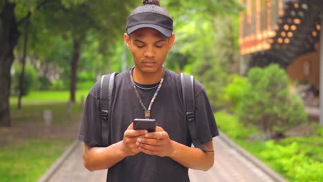 trendy-student-texting-message-use-mobile-outdoor