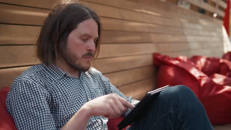 young-handsome-fashion-model-businessmen-using-tablet-outdoors,-man-male-portrait-with-tablet-in-city-work