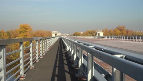 Unfinished-bridge-against-the-background-of-the-silhouette-of-the-city.-Unfinished-highway-away-city