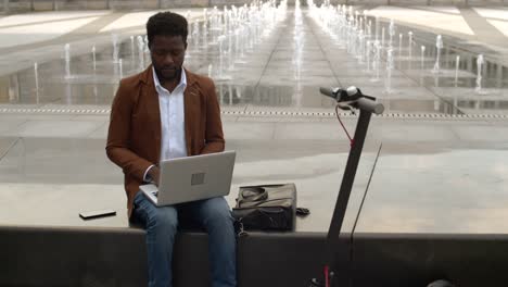 African-Businessman-Working-Outdoors