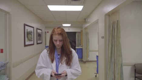 Nurse-Using-Smart-Phone-In-Hospital