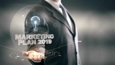 Marketingplan-2019-mit-Glühbirne-Hologramm-Geschäftsmann-Konzept