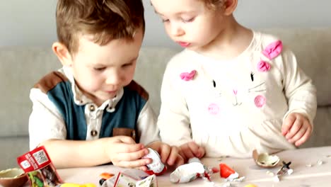 cute-little-children-with-kinder-surprise-eggs-and-toys