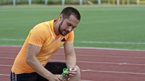 Tired-Handicapped-Athlete-Pouring-Water-on-Head-during-Run