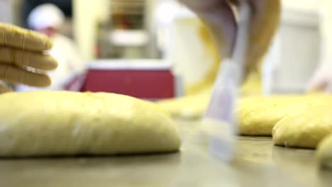 pastry-chef-hands-preparing-the-dough-for-Easter-cake-doves