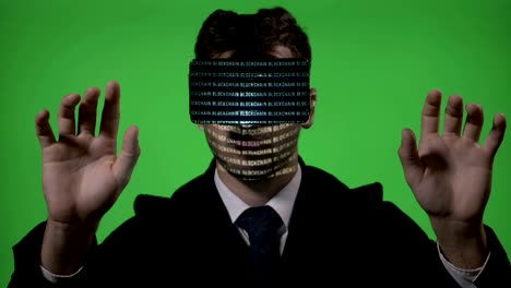 Male-engineer-dressed-in-suit-and-tie-using-futuristic-virtual-reality-technology-to-type-and-check-blockchain-data-on-green-screen