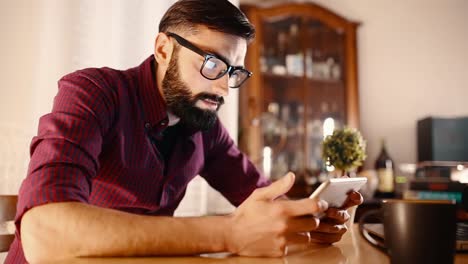 man-using-tablet-at-home.