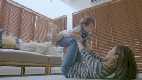 Mother-and-her-baby-son-having-fun-and-playing-at-home