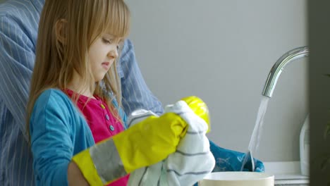 Girl-Wiping-Clean-Dishes-with-Cloth