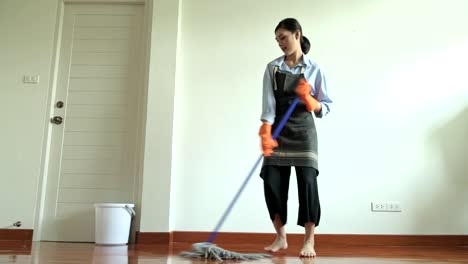 Woman-cleaning-house-with-a-mop.