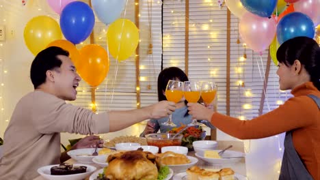 Little-girl-having-dinner-with-her-family-at-home.-Girl-enjoy-for-special-dinner-with-her-family.-People-with-party-and-celebration-concept.-4K-Resolution.