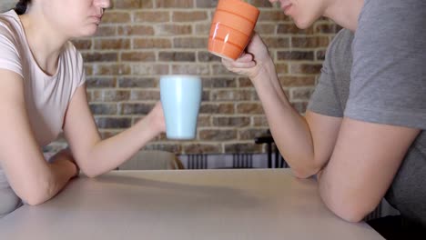 Young-man-and-woman-at-the-table-drinking-tea