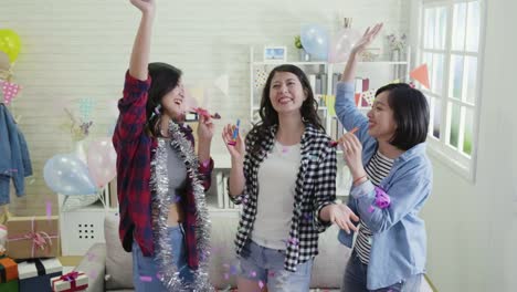 young-women-dancing-playing-with-blowers-balloon