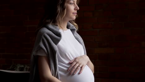 Pregnant-woman-caressing-her-tummy