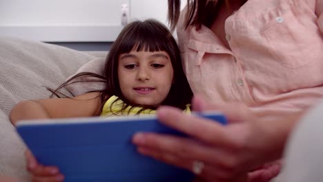 Mom-and-daughter-using-a-digital-tablet-together