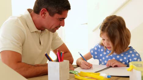 Father-and-daughter-drawing-together