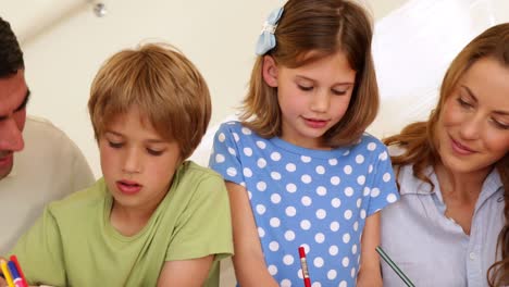 Cute-parents-and-children-colouring-together