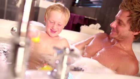 Modern-Dad-Plays-with-Son-in-Bubble-Bath-at-Home