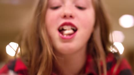 Close-up,-young-girl-with-braces-eating-ice-cream,-slow-motion