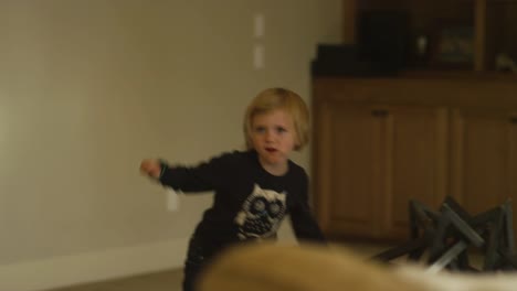 A-little-girl-being-silly-and-dancing-in-her-living-room