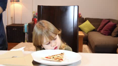 child-does-not-like-pizza-but-plays-with-it