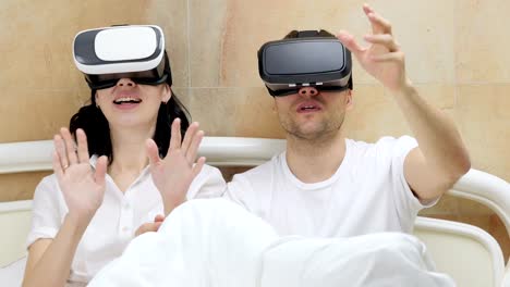 Couple-using-VR-glasses.