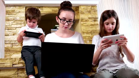 kids-fond-of-playing-their-electronic-gadgets,-every-child-looking-into-their-tablets-screens