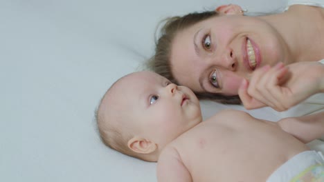 Mother-with-Baby-in-Bed-Cuddling