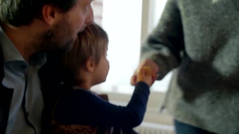 modern-family-little-girl-having-breakfast-with-dad-indoor-in-modern-industrial-house.-caucasian.-4k-handheld-slow-motion-close-up-video-shot