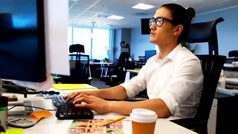 Male-graphic-designer-working-at-desk