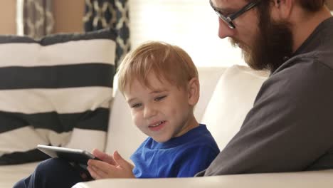 Father-and-Son-using-smart-phone-together