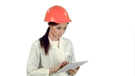 Female-engineer-in-helmet-using-tablet-computer-on-white-background