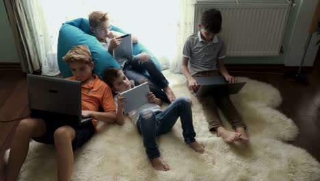 Family-of-brothers-uses-electronic-gadgets-at-home