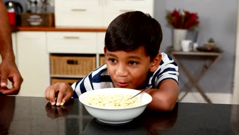 Boy-having-breakfast-in-kitchen-4k