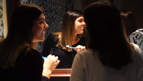 Teenager-Dancing-and-Singing-while-Brushing-Teeth-at-Mirror