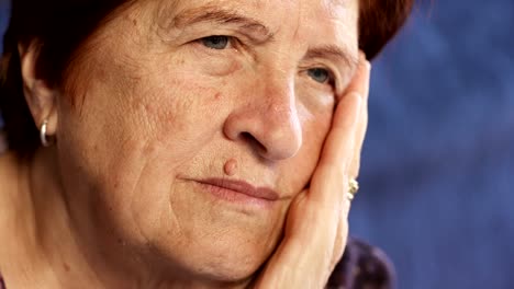 Pensive,worried-old-woman-close-up.-Portrait-of-sad-elderly-woman