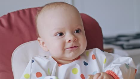 A-Baby-Girl-Eating-Bread-at-Home