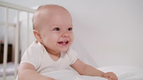 Baby-Standing-near-the-bed-at-Home