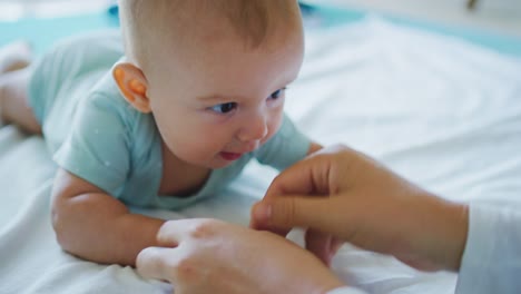 Mother-Playing-with-Young-Baby