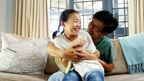 Happy-father-and-daughter-having-fun-in-living-room-4k