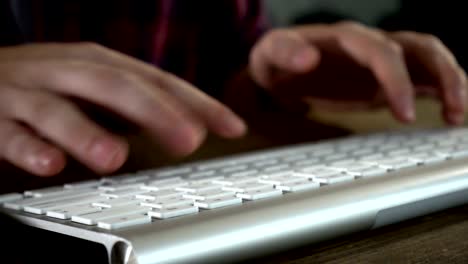 Focus-at-hand-of-freelancer-typing-on-keyboard