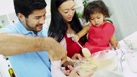 Asian-Chinese-parents-pre-school-daughter-kitchen-baking