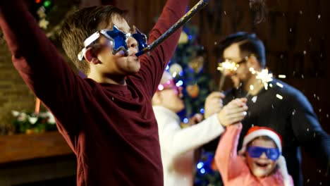 Young-family-celebrating-Christmas-with-sparklers