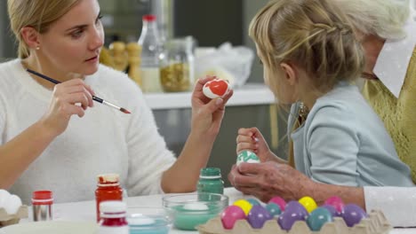 Elderly-Woman-Preparing-for-Easter-with-Daughter-and-Granddaughter