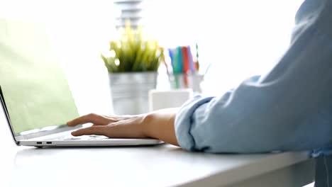 Close-up-hand-typing-on-a-Keyboard-computer-laptop-at-office.-One-young-woman-only-using-computer-desktop-PC.