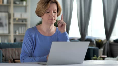 Pensive-Old-Senior-Woman-Thinking-and-Working-on-Laptop